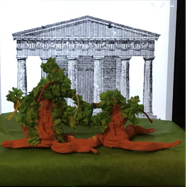 Model of Baucis and Philemon embracing, having transformed into trees in front of a temple.